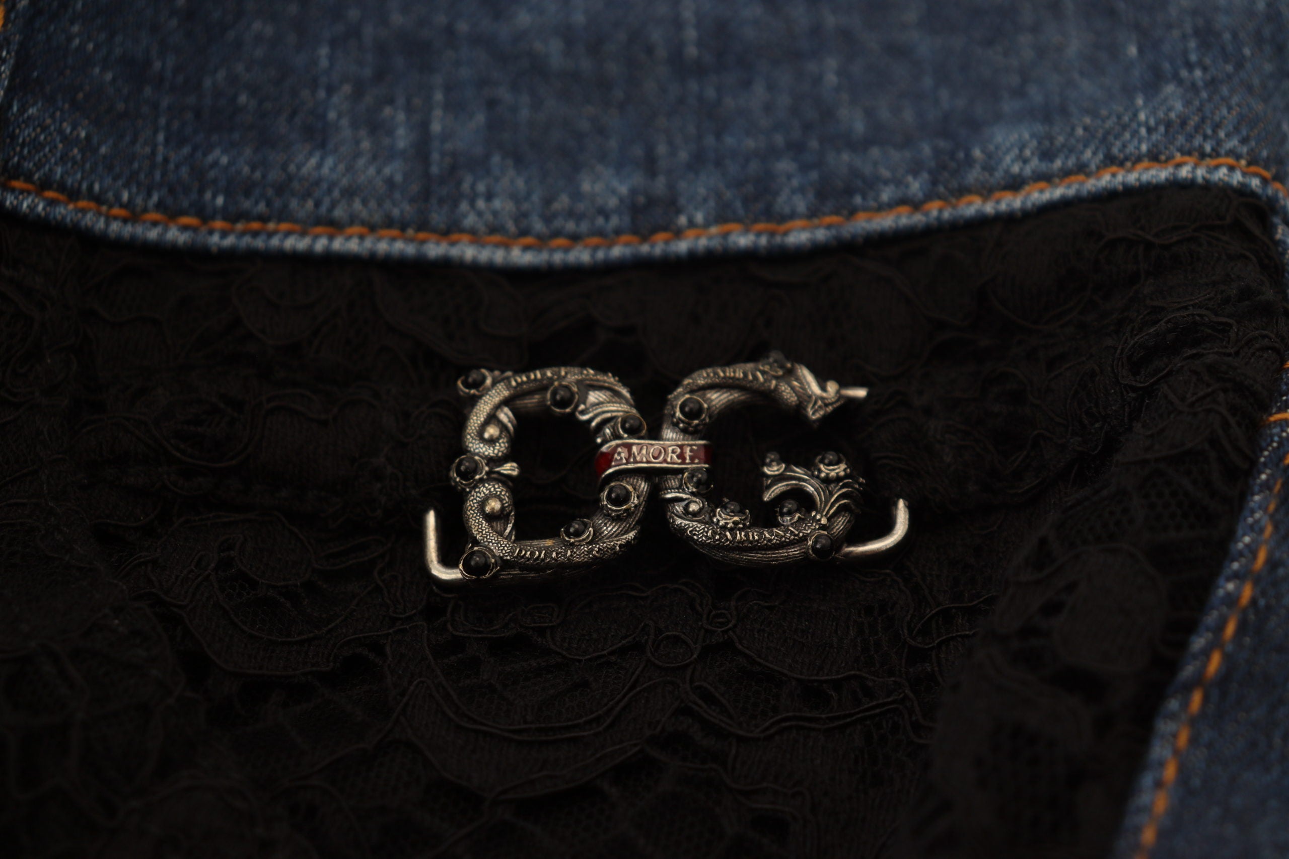 Black floral lace front skinny denim jeans by Dolce & Gabbana, featuring lace details and a fitted denim silhouette.