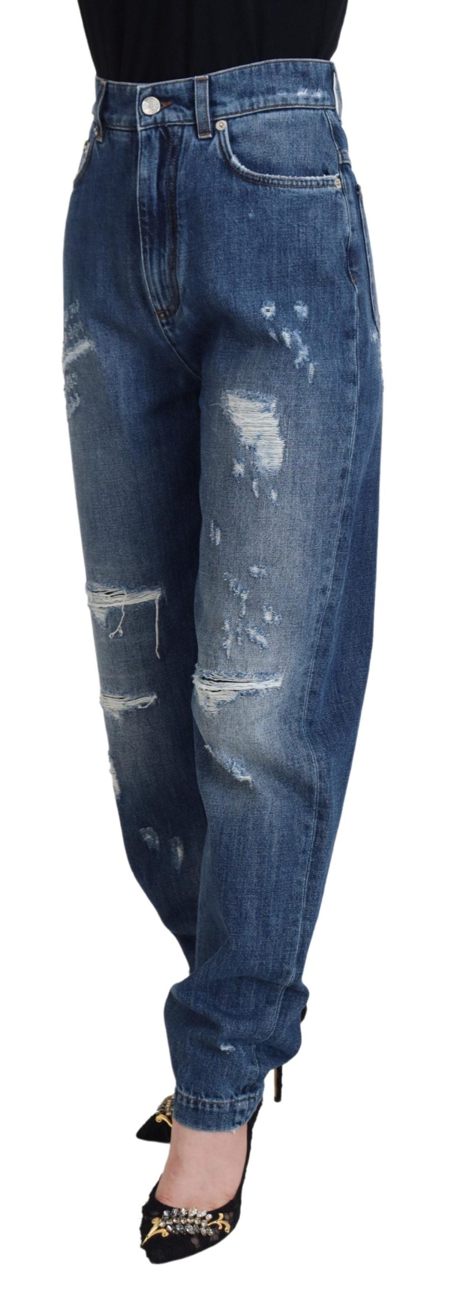 Blue washed cotton tattered denim jeans by Dolce & Gabbana, featuring distressed details and a relaxed fit.