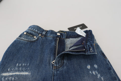 Blue washed cotton tattered denim jeans by Dolce & Gabbana, featuring distressed details and classic five-pocket design.