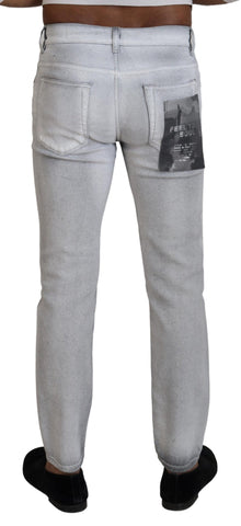 Gray washed skinny men's denim jeans by Dolce & Gabbana, showing close-up of fitted style and textured fabric details.