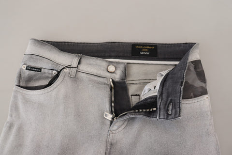 Gray washed skinny men's denim jeans by Dolce & Gabbana, showing close-up of fitted fabric and stylish design details.