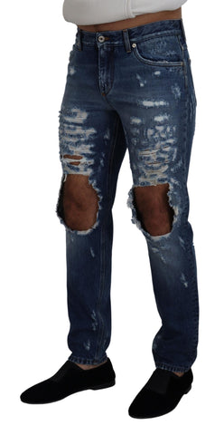 Blue cotton tattered men's denim jeans by Dolce & Gabbana with distressed details and classic fit.