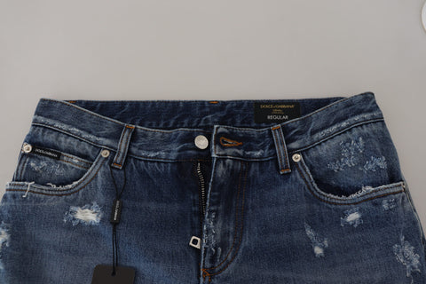 Blue cotton denim jeans for men with a tattered design by Dolce & Gabbana, shown in front view.