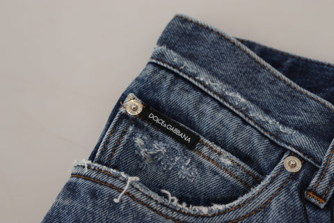 Blue cotton tattered men's denim jeans by Dolce & Gabbana, showing distressed details and classic fit.