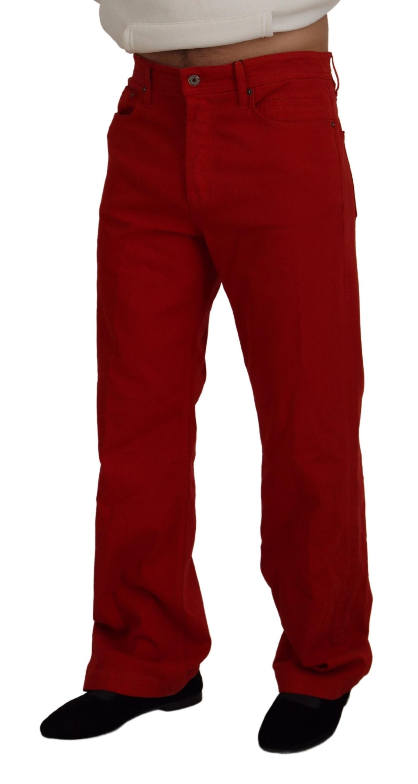 Red cotton straight fit denim jeans for men by Dolce & Gabbana, displayed flat with visible stitching and classic five-pocket design.