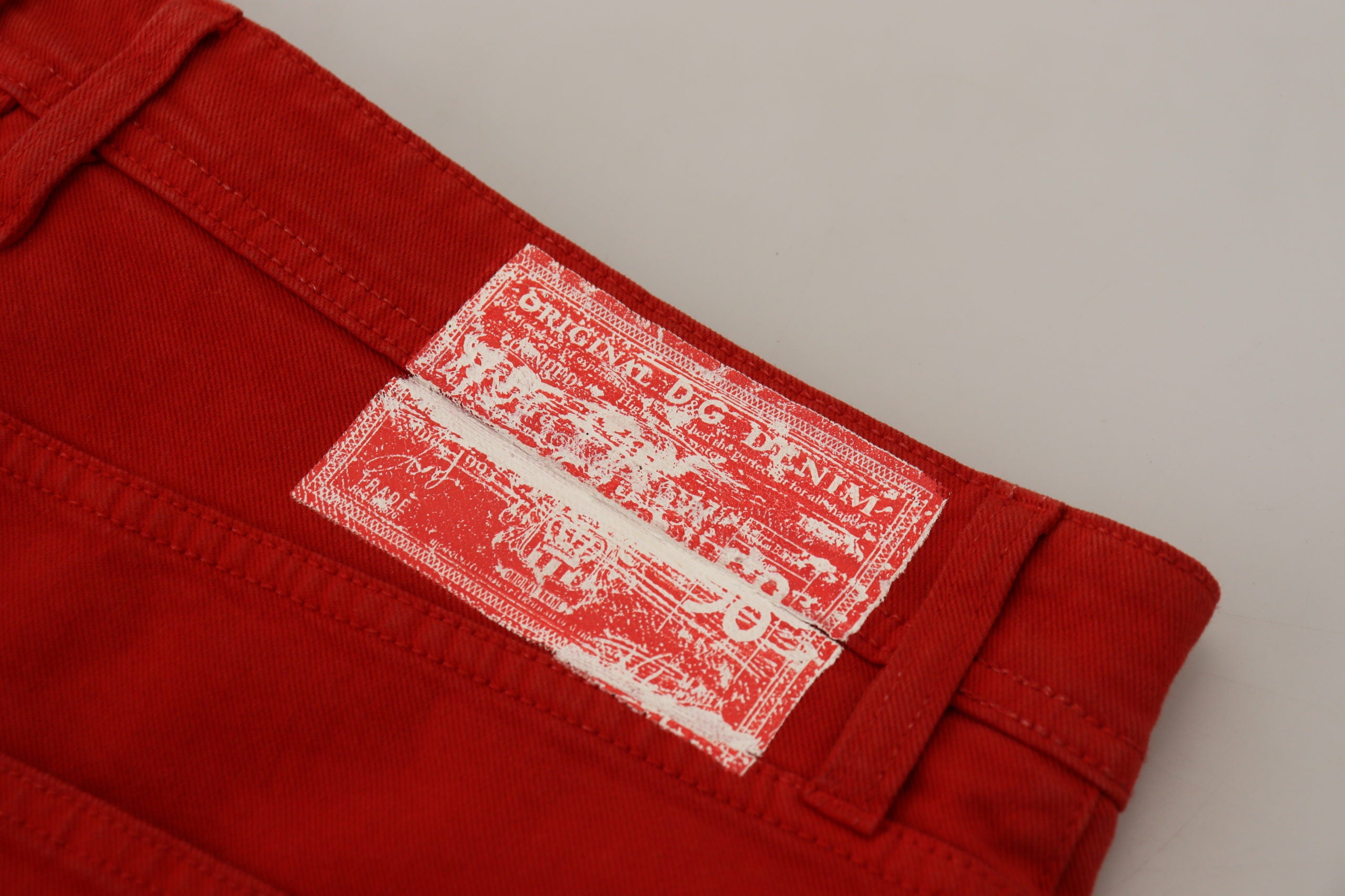 Red cotton straight fit men's denim jeans by Dolce & Gabbana, showing front view with classic five-pocket design.