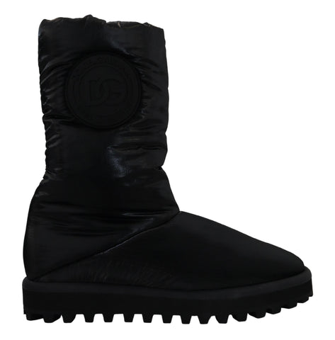 Black padded mid-calf winter boots by Dolce & Gabbana, featuring a stylish design and sturdy sole for cold weather comfort.