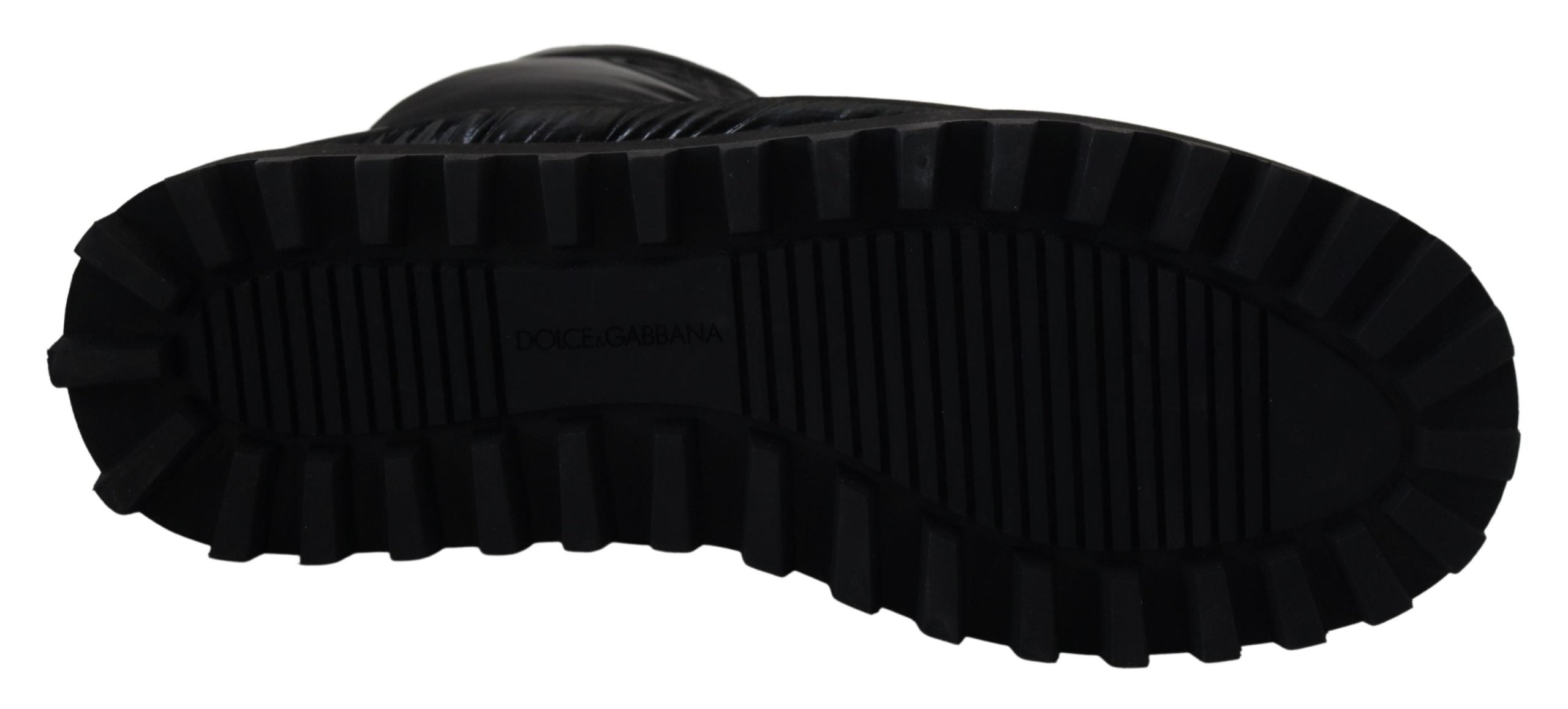 Black padded mid calf winter boots by Dolce & Gabbana with thick soles and stylish design, perfect for cold weather.