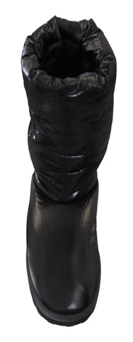 Black padded mid-calf winter boots by Dolce & Gabbana with sturdy soles and stylish design, suitable for cold weather.