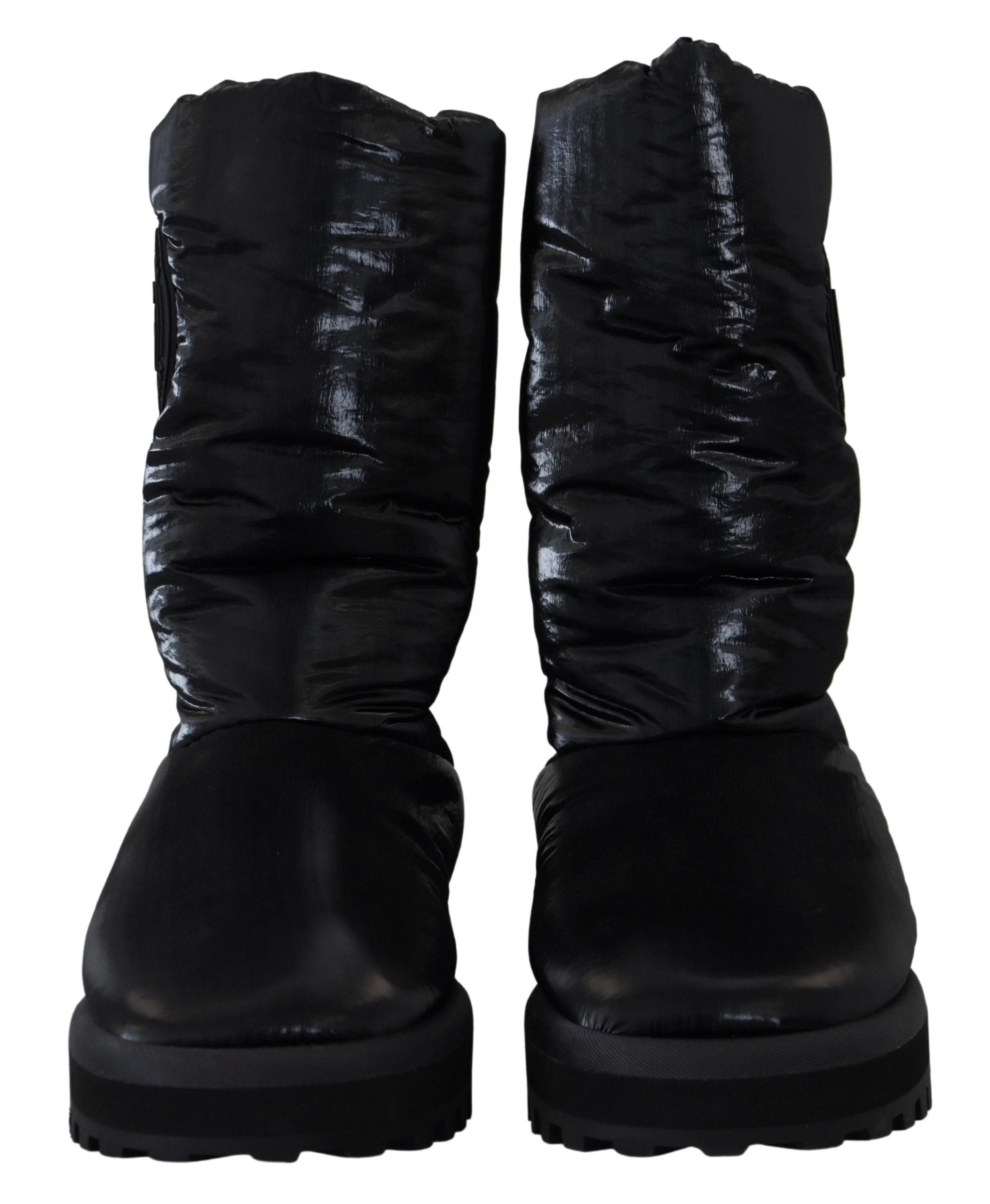 Black padded mid-calf winter boots by Dolce & Gabbana, showcasing a stylish design with a sturdy sole and cozy interior.
