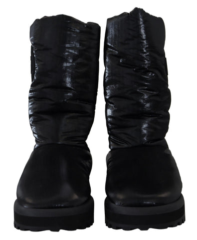 Black padded mid-calf winter boots by Dolce & Gabbana, showcasing a stylish design with a sturdy sole and cozy interior.