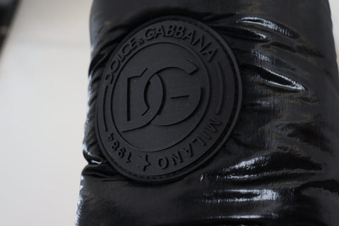 Black padded mid-calf winter boots by Dolce & Gabbana featuring a sleek design and sturdy sole for cold weather wear.