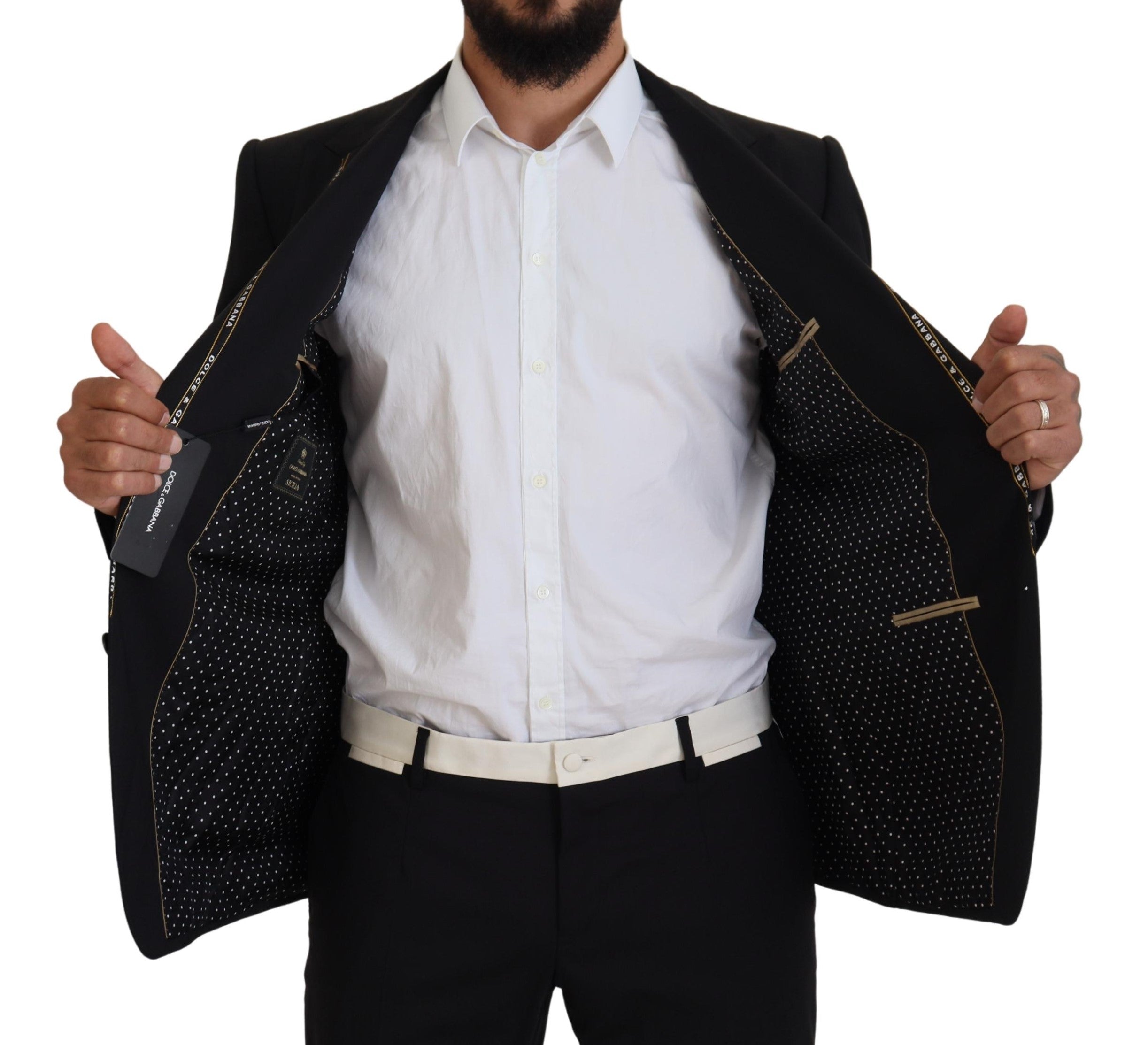 Black wool stretch slim fit blazer jacket by Dolce & Gabbana, shown on a hanger with a tailored design and classic lapel.