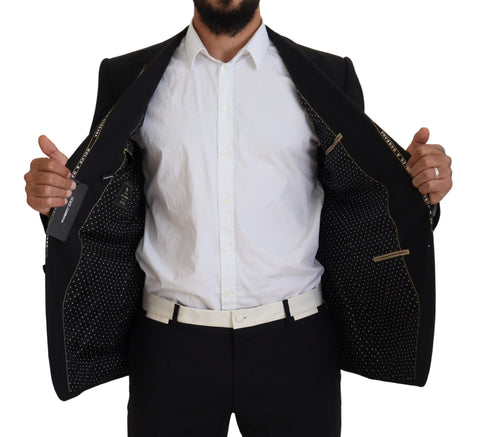 Black wool stretch slim fit blazer jacket by Dolce & Gabbana, shown on a hanger with a tailored design and classic lapel.