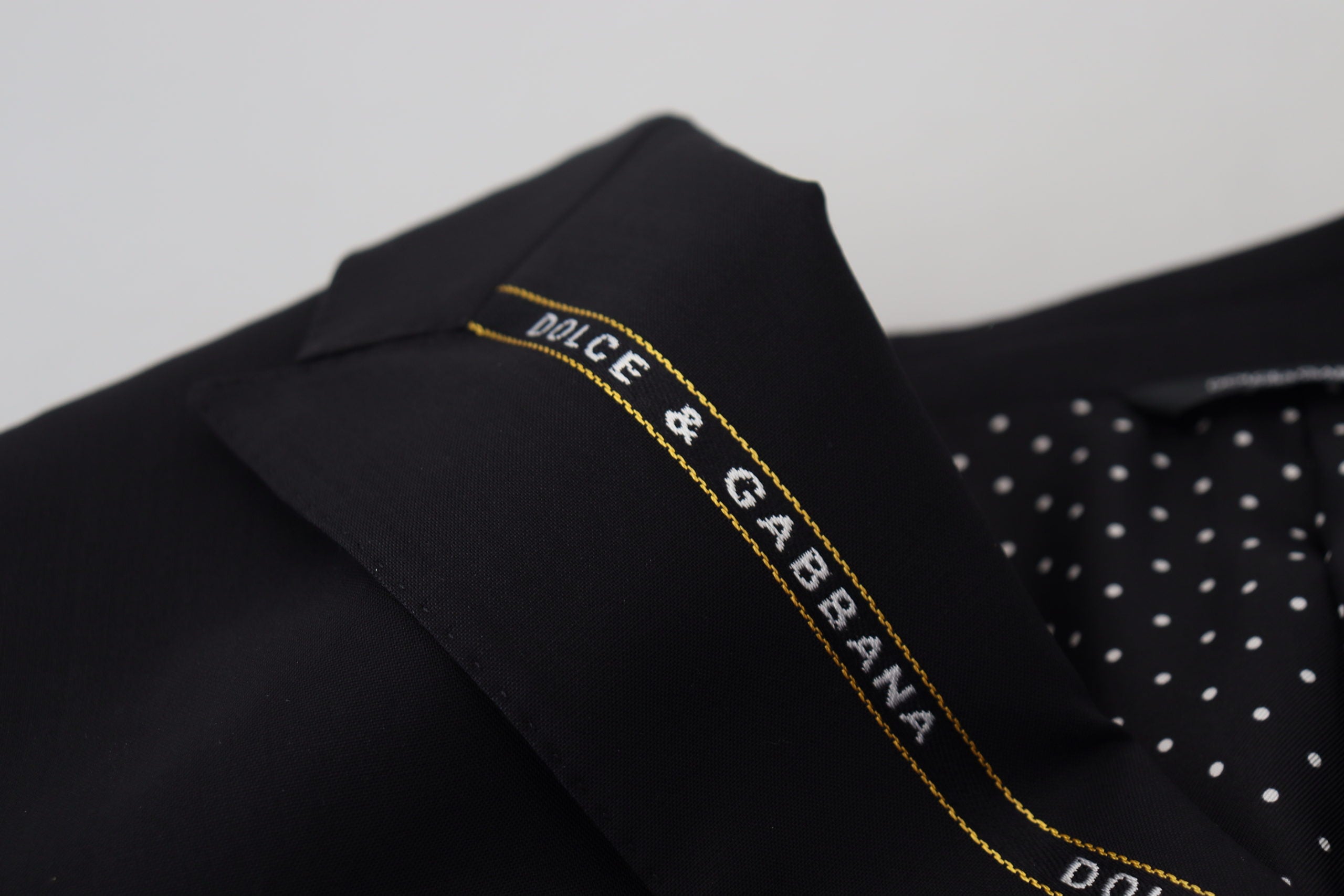 Black wool stretch slim fit blazer jacket by Dolce & Gabbana, tailored fit with sleek lapels and structured design.