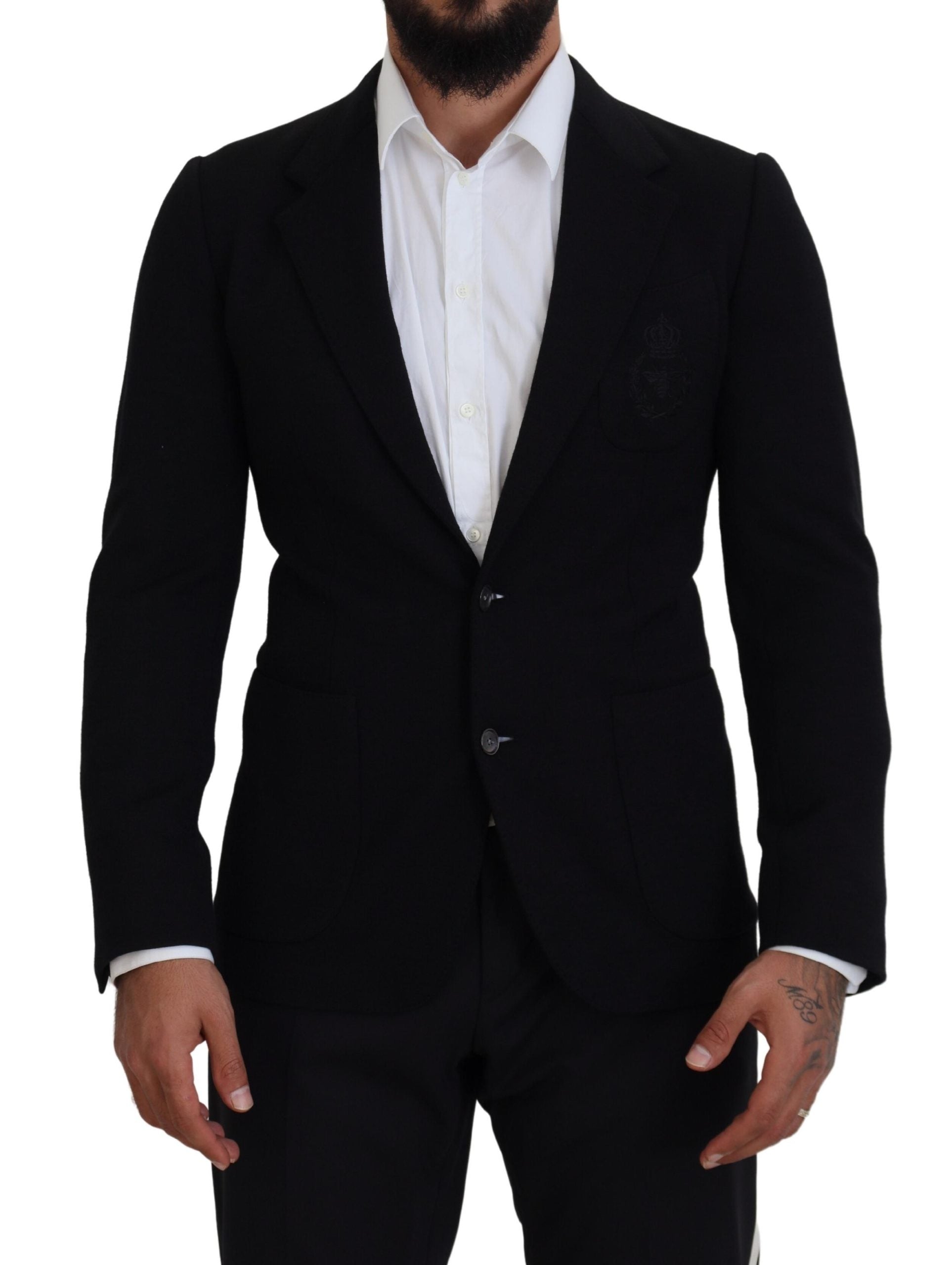 Black wool blazer jacket by Dolce & Gabbana featuring a slim fit and classic collar, displayed on a hanger.