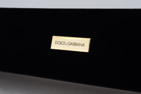 Black velvet jewelry box with Dolce & Gabbana logo plaque, designed for storing bracelets and jewelry accessories.