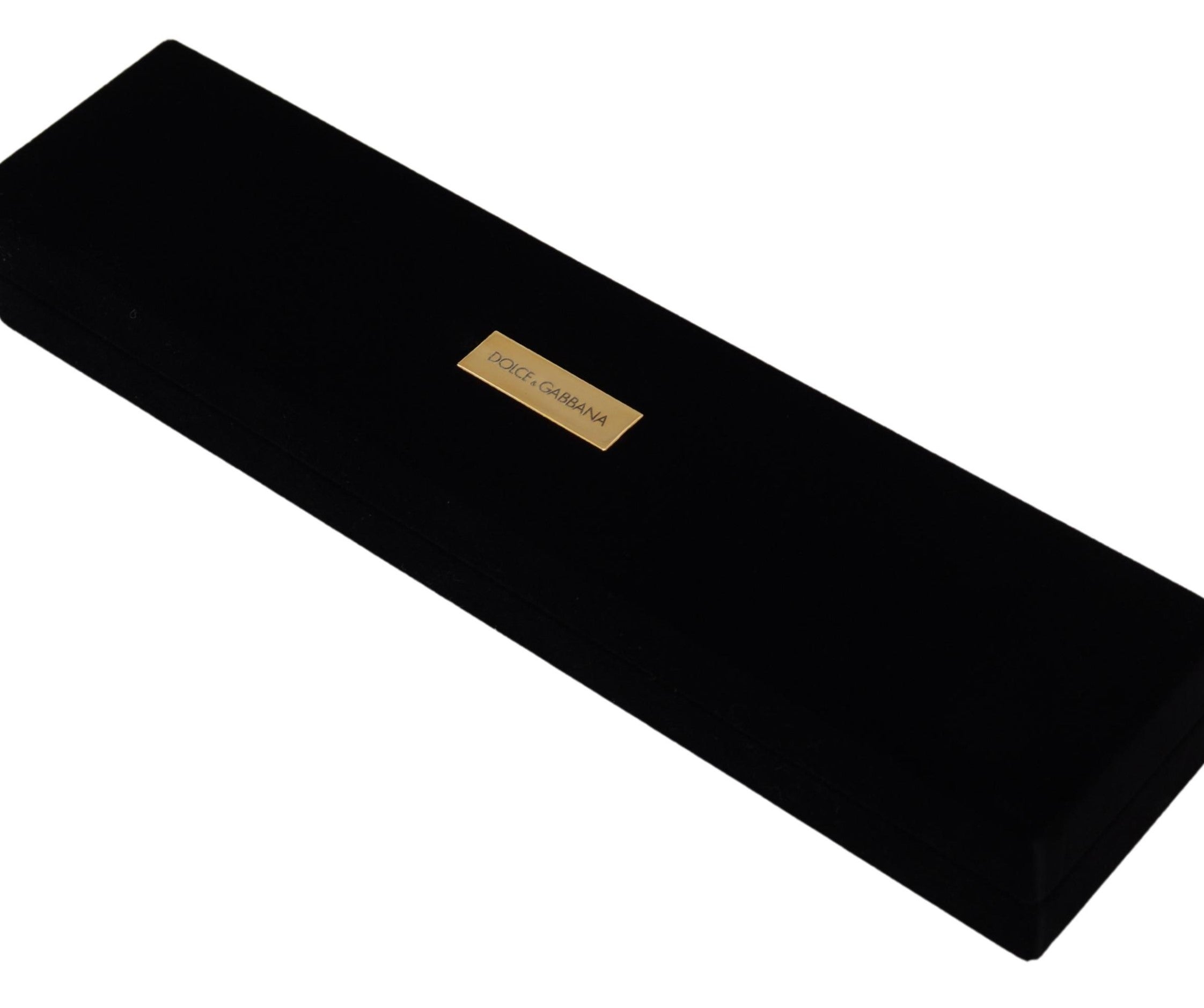Black velvet jewelry box with Dolce & Gabbana logo plaque for storing bracelets and jewelry, elegant and soft-lined interior.