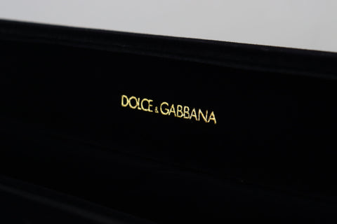 Black velvet jewelry box with Dolce & Gabbana logo plaque, designed for storing bracelets and jewelry securely.