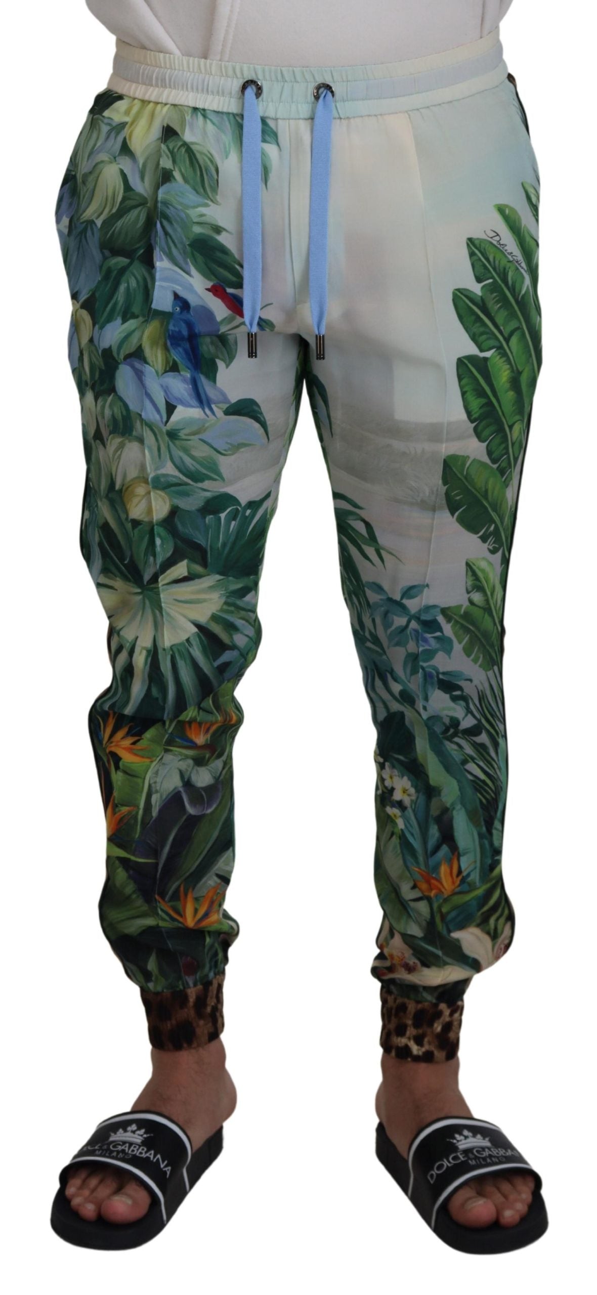 White floral printed men's jogger pants by Dolce & Gabbana featuring a relaxed fit and floral design on soft fabric.