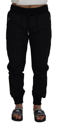 Black men's casual jogger pants by Dolce & Gabbana, shown with a relaxed fit and elastic waistband, styled for everyday wear.