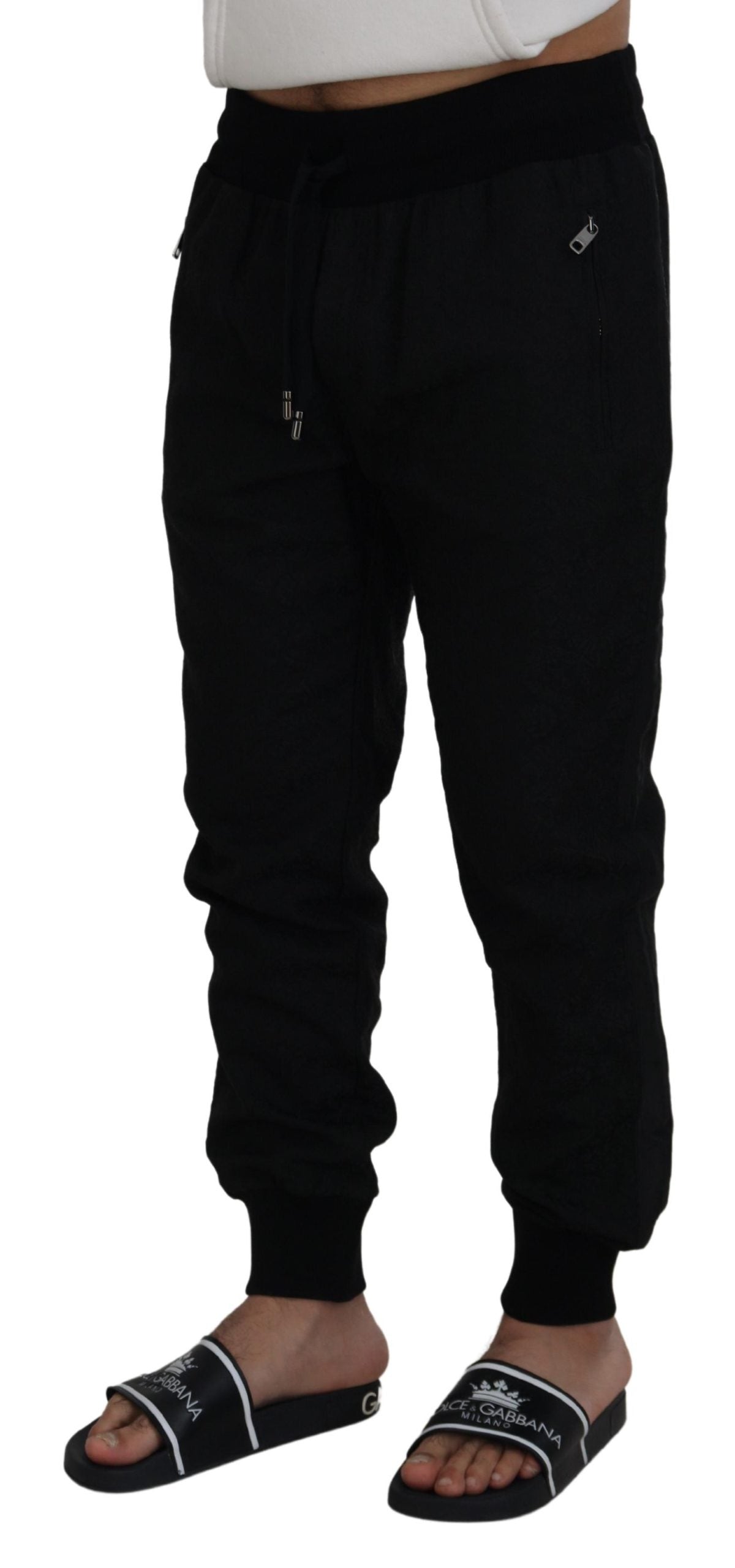 Black men's casual jogger pants by Dolce & Gabbana, featuring a relaxed fit with elastic waistband and tapered cuffs.