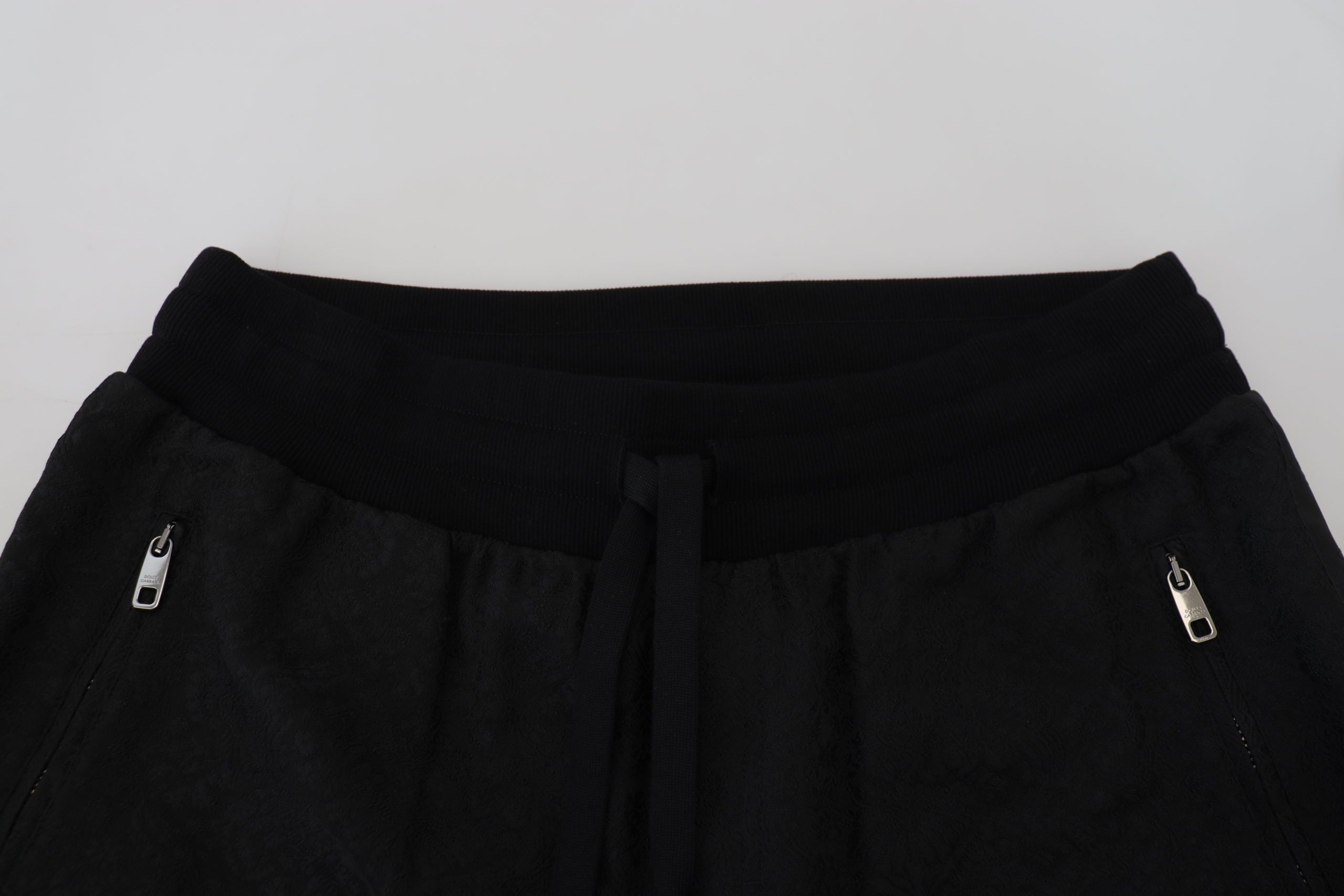 Black men's casual jogger pants by Dolce & Gabbana, featuring a relaxed fit and elastic waistband, shown on a model.