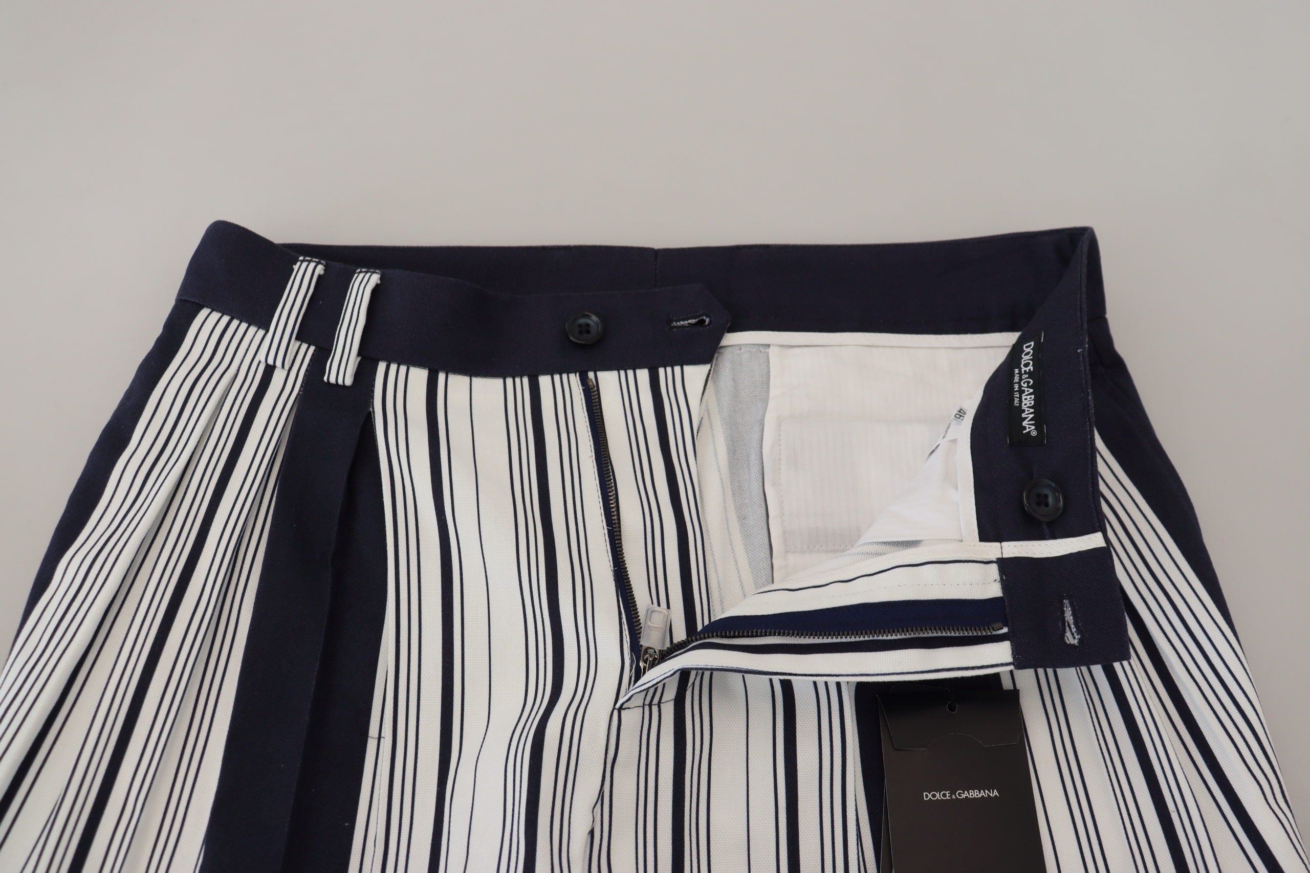 White cotton striped cropped pants by Dolce & Gabbana, featuring a relaxed fit and stylish ankle-length design.