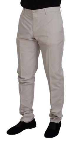 Dolce & Gabbana off-white silk mid-waist chino pants with tailored fit and side pockets, styled on a model.