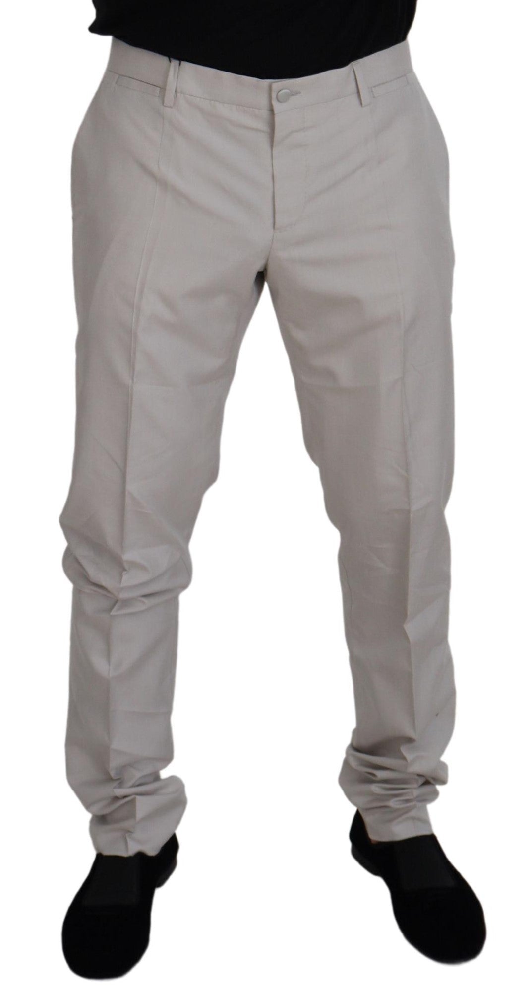 Dolce & Gabbana off white silk mid waist chino pants displayed on a hanger with front pockets and tailored fit.