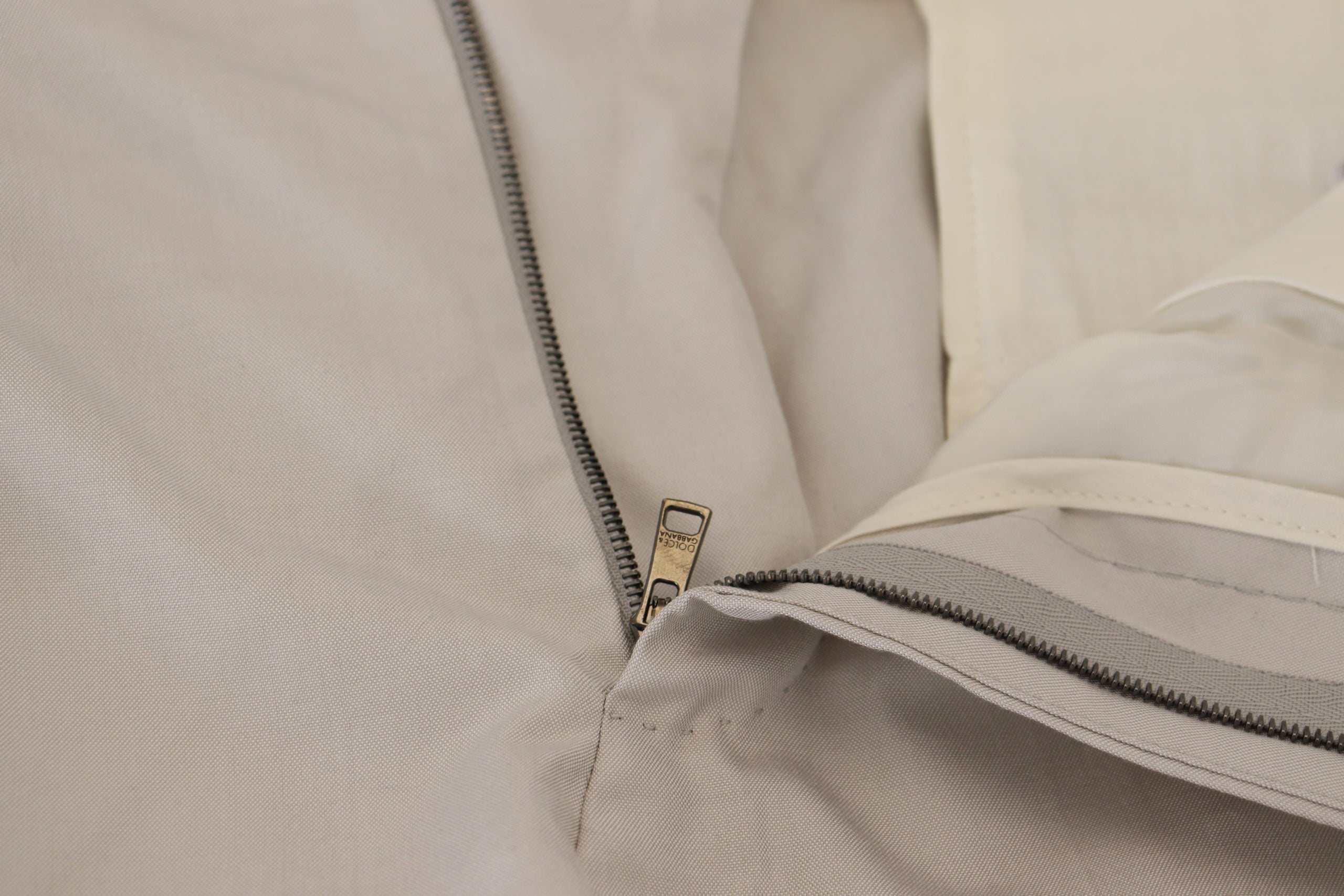 Off White silk mid-waist chino pants by Dolce & Gabbana, tailored fit with clean design and subtle sheen.