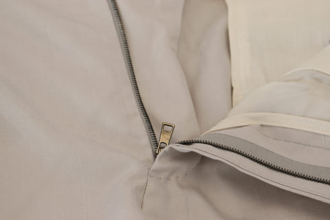 Off White silk mid-waist chino pants by Dolce & Gabbana, tailored fit with clean design and subtle sheen.