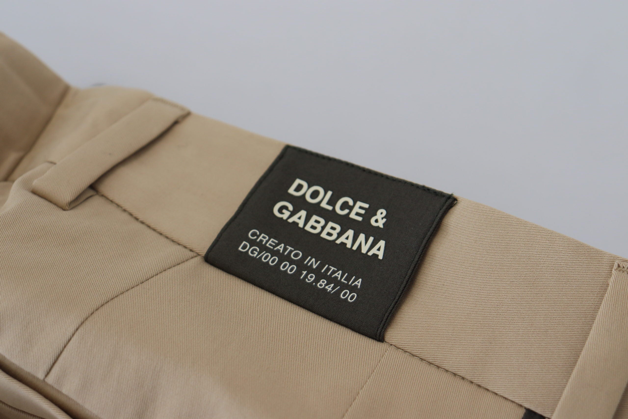 Men's brown and black cotton chino pants by Dolce & Gabbana, featuring a tailored fit and classic design.