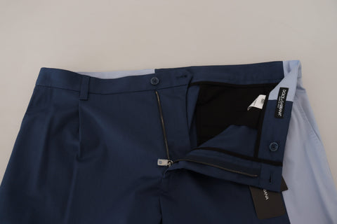 Blue cotton straight fit pants by Dolce & Gabbana, shown on a model, with a focus on the tailored design and fabric texture.