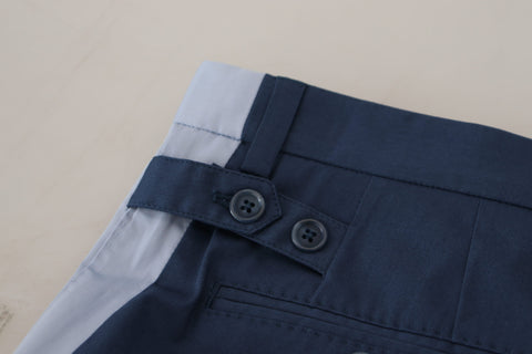 Blue cotton straight fit pants by Dolce & Gabbana, shown on a hanger with a clean background.