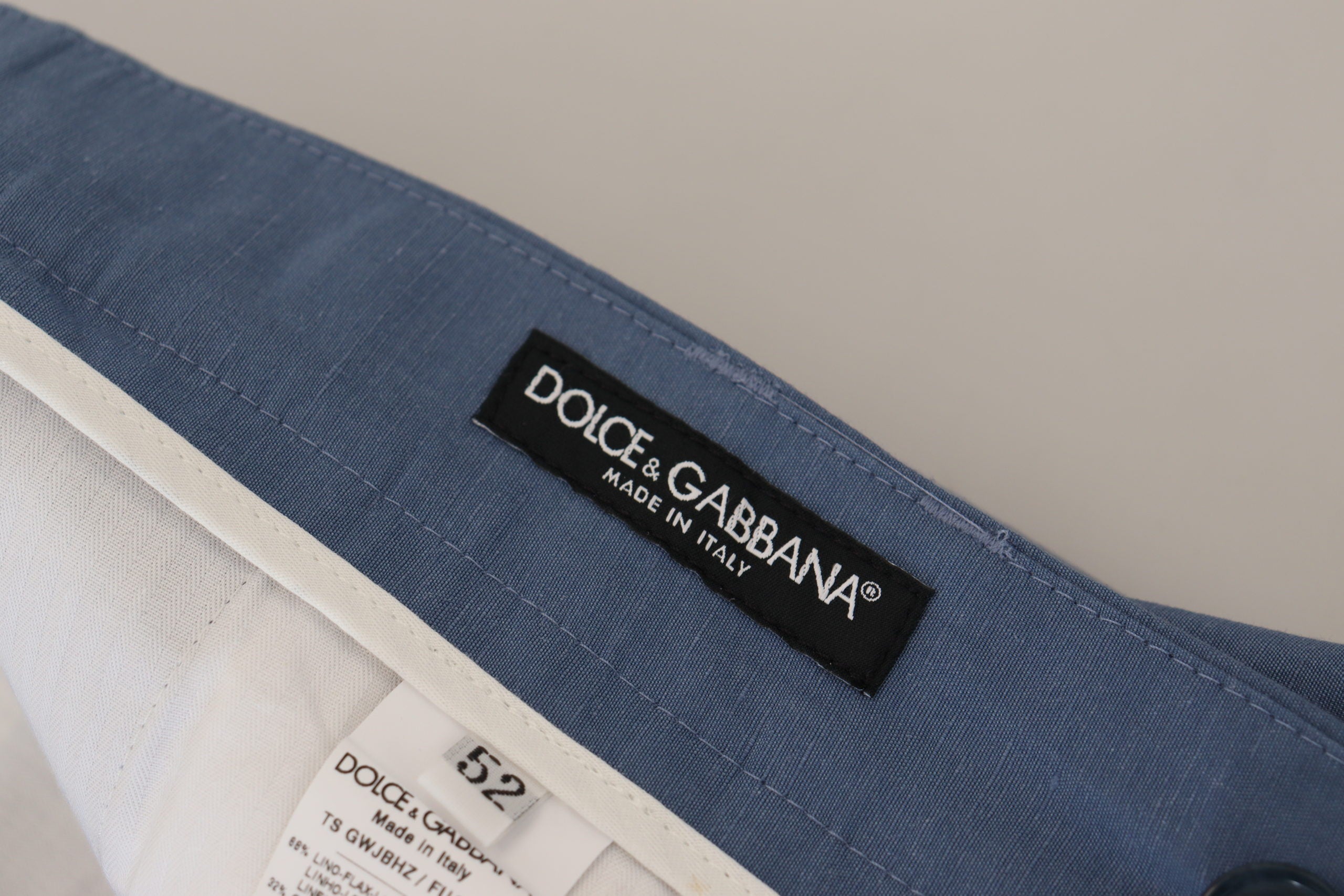 Blue linen chino formal pants by Dolce & Gabbana, tailored fit with classic design and front pockets.