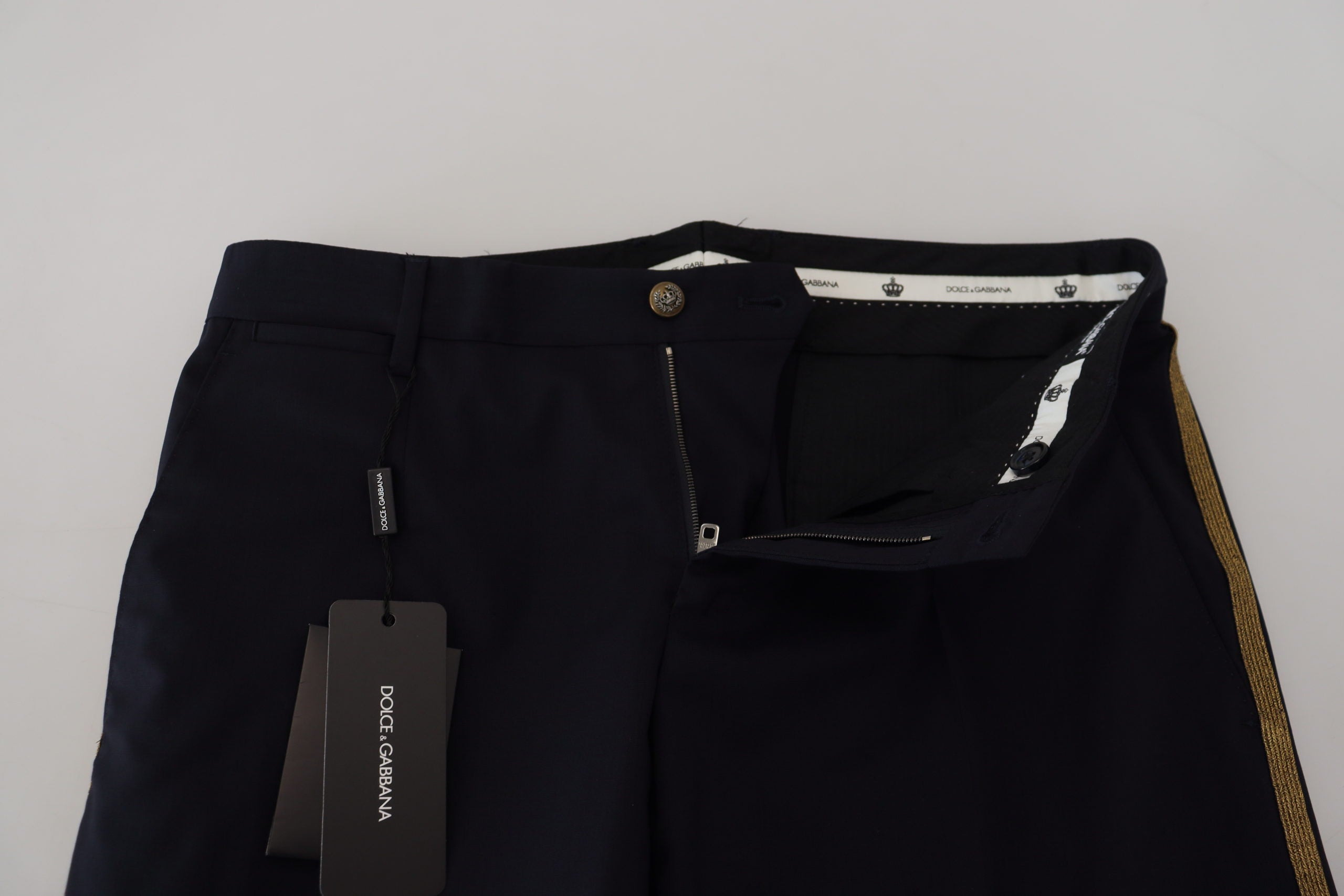 Black wool slim formal pants by Dolce & Gabbana, showing tailored fit and sleek design on a plain background.