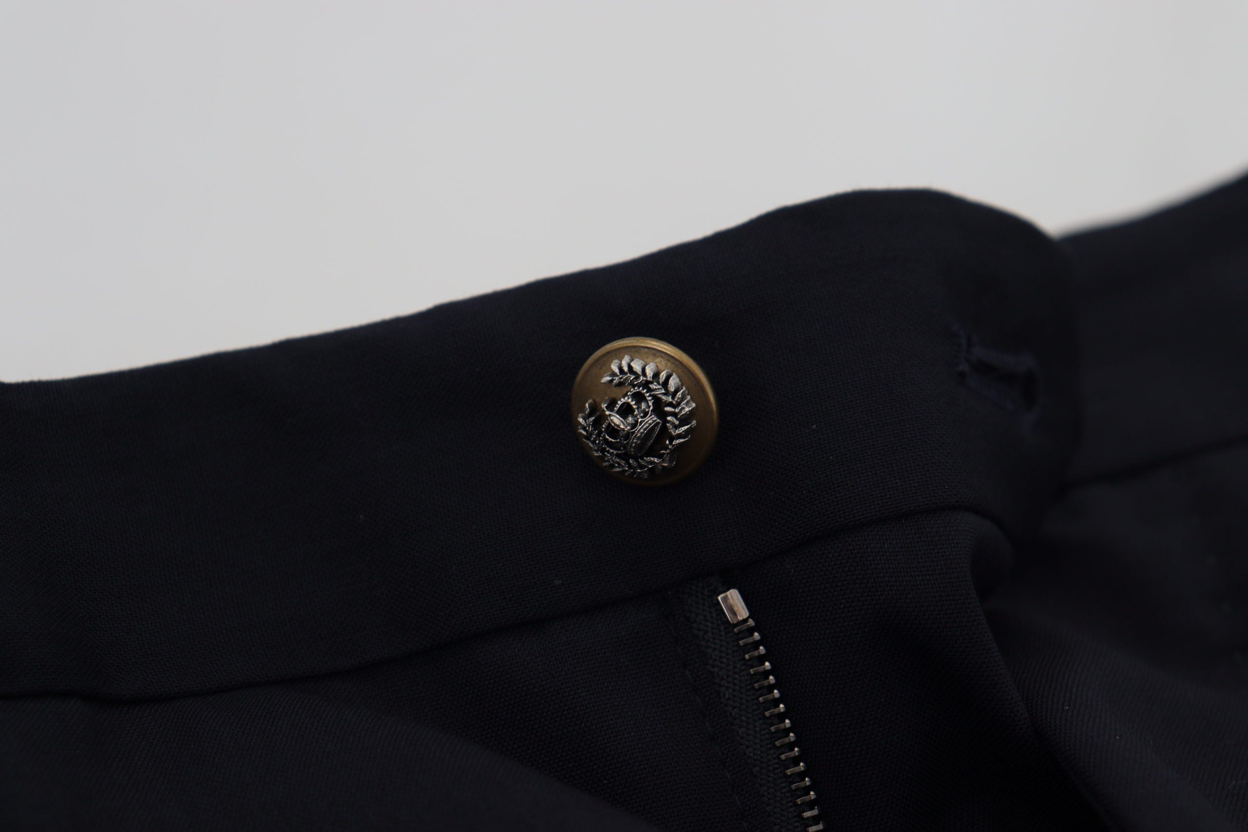 Black wool slim formal pants by Dolce & Gabbana, tailored fit with sleek design, shown on a hanger.