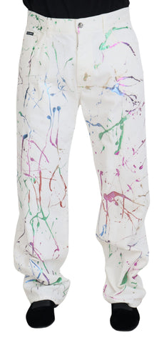 White cotton denim pants with colorful splash print by Dolce & Gabbana, featuring a relaxed fit and classic five-pocket design.