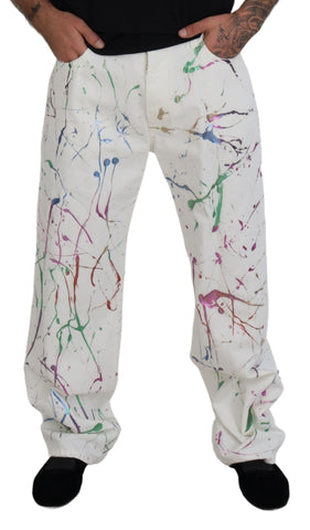White cotton denim pants with colorful splash print from Dolce & Gabbana, showcasing a relaxed fit and stylish design.