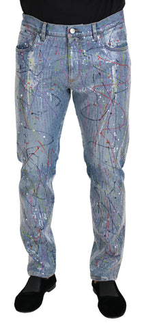 Blue cotton denim jeans with color splash print by Dolce & Gabbana, showing the stylish design and fabric details.
