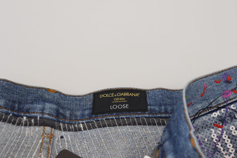 Blue cotton denim jeans with colorful splash print from Dolce & Gabbana, showcasing a relaxed fit and stylish design.