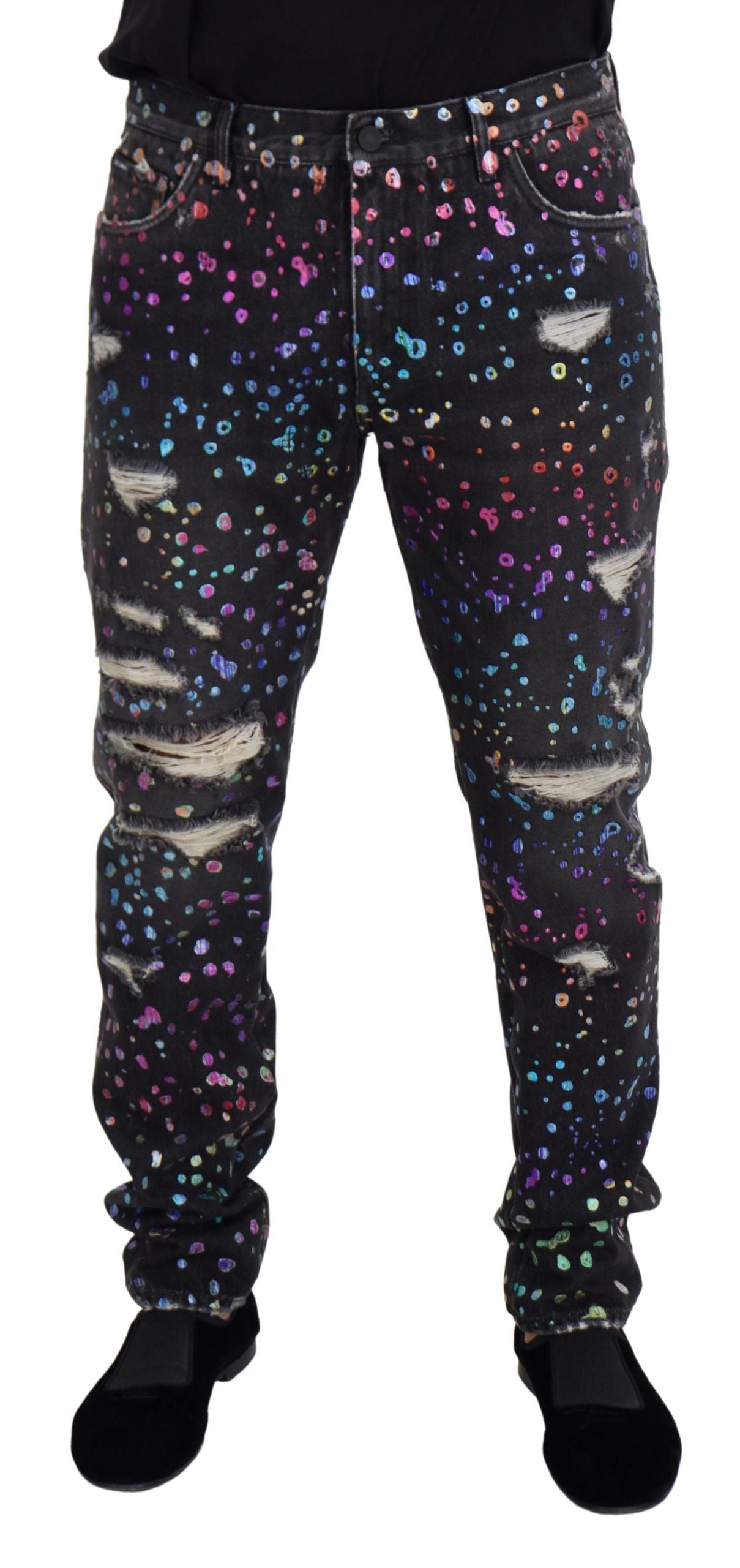 Black multicolor print tattered denim jeans by Dolce & Gabbana, featuring distressed details and vibrant multicolor patterns.