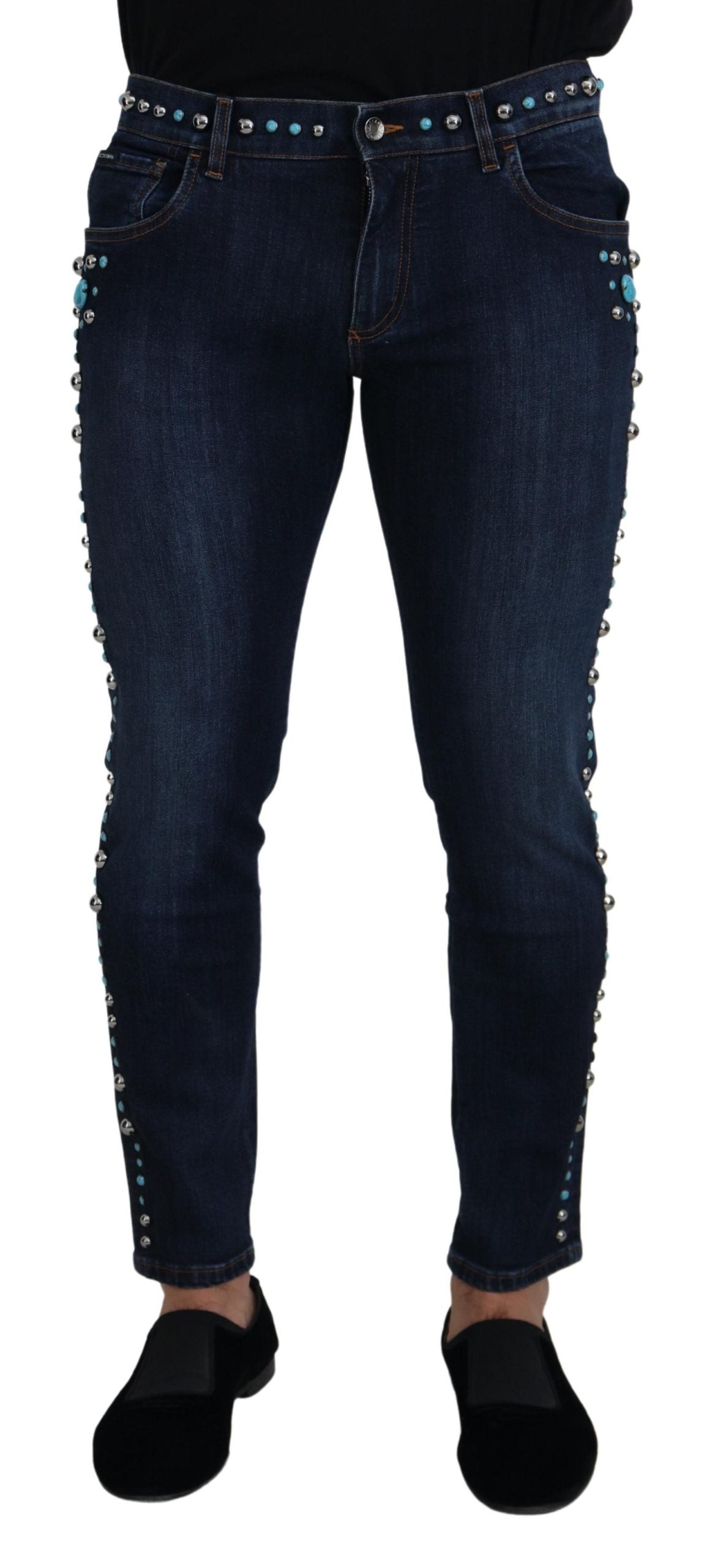 Blue cotton studded low waist denim jeans by Dolce & Gabbana, showing close-up of studded details and relaxed fit.