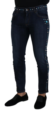 Blue cotton denim jeans with studded details, low waist style by Dolce & Gabbana, shown with front view and belt loops.