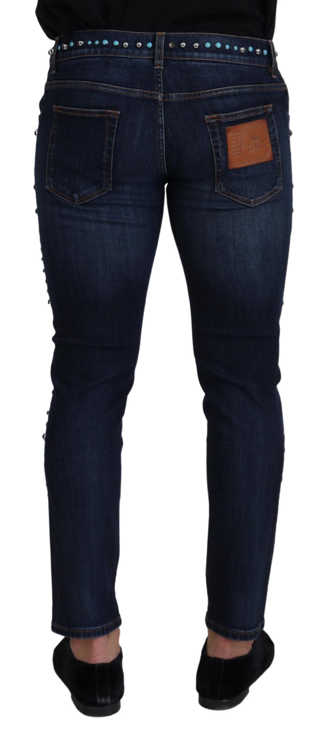 Blue cotton low waist denim jeans with studded details by Dolce & Gabbana, showcasing the fit and stylish design.