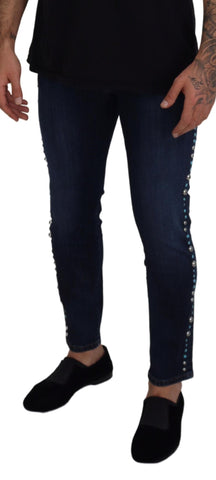 Blue cotton studded low waist denim jeans by Dolce & Gabbana, showing front view with studded details and classic denim styling.