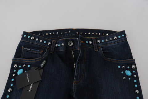 Blue cotton studded low waist denim jeans by Dolce & Gabbana, showing front view with studded details and classic five-pocket design.