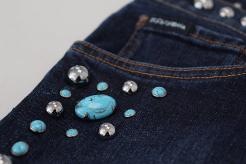 Blue cotton studded low waist denim jeans by Dolce & Gabbana, featuring a fitted design and stylish studded accents.