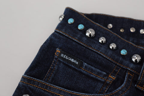 Blue cotton studded low waist denim jeans by Dolce & Gabbana, showing front view with stud embellishments and slim fit cut.